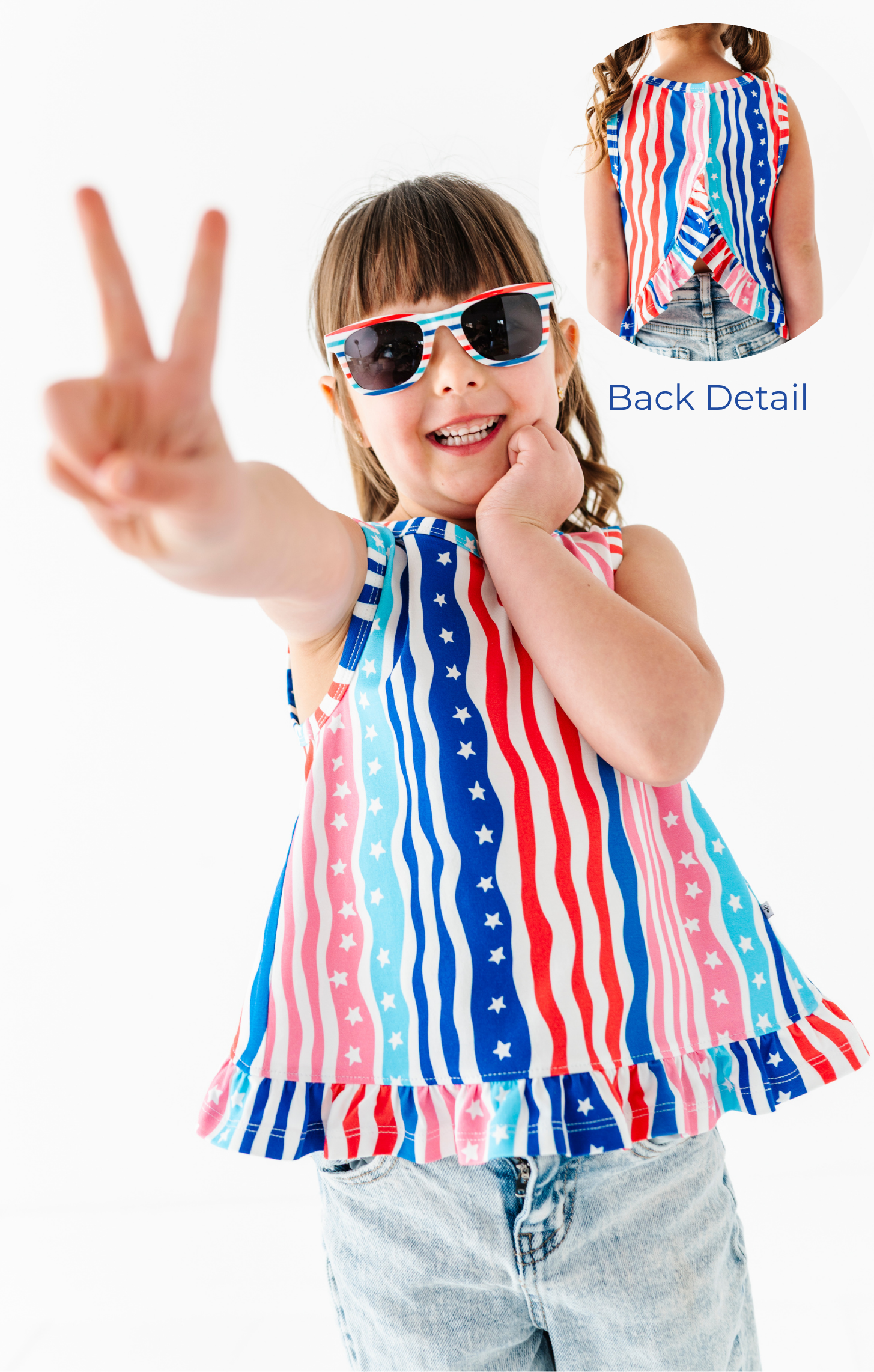 Child wearing a red, white, and blue striped bamboo-cotton top with star patterns, making a peace sign.